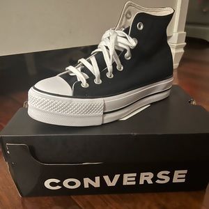 Women lift high converse